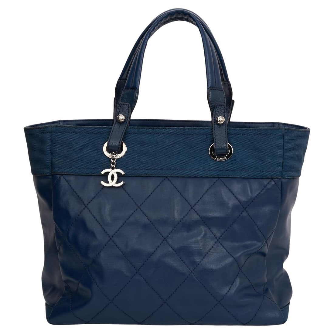 Chanel Blue Paris-Biarritz PM Tote with CC Logo and Hologram: Chanel Blue Paris-Biarritz PM Tote with CC Logo and Hologram Introducing the Chanel Blue Paris-Biarritz PM Tote, a stylish blend of modern design and luxury. Crafted from blue canvas combined with dia