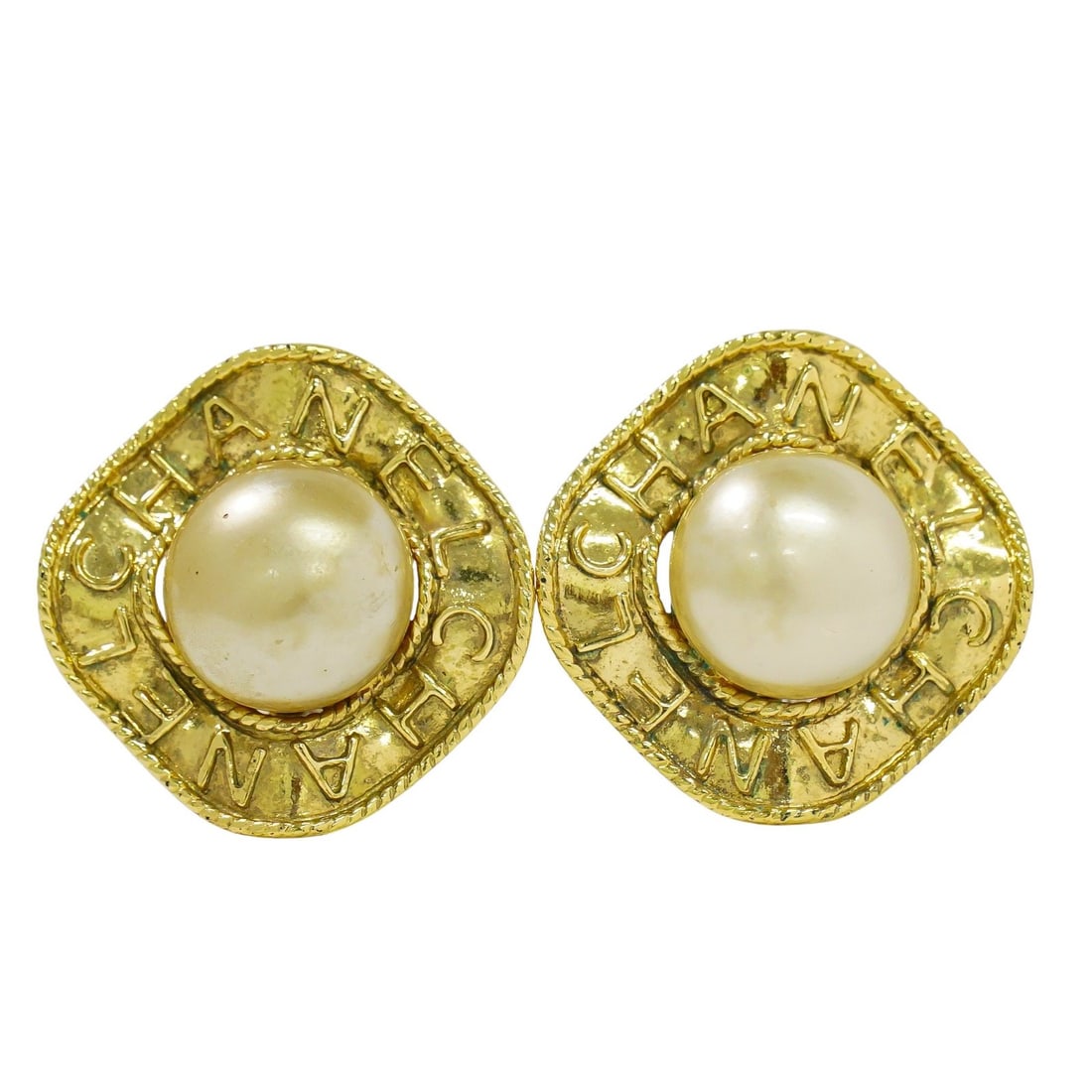 Vintage Chanel Gold Tone Circular CC Clip-On Earrings: Vintage Chanel Gold Tone Circular CC Clip-On Earrings These Chanel vintage round CC clip-on earrings feature a gold-tone finish and the iconic interlocking CC logo. Designed for women, they show light