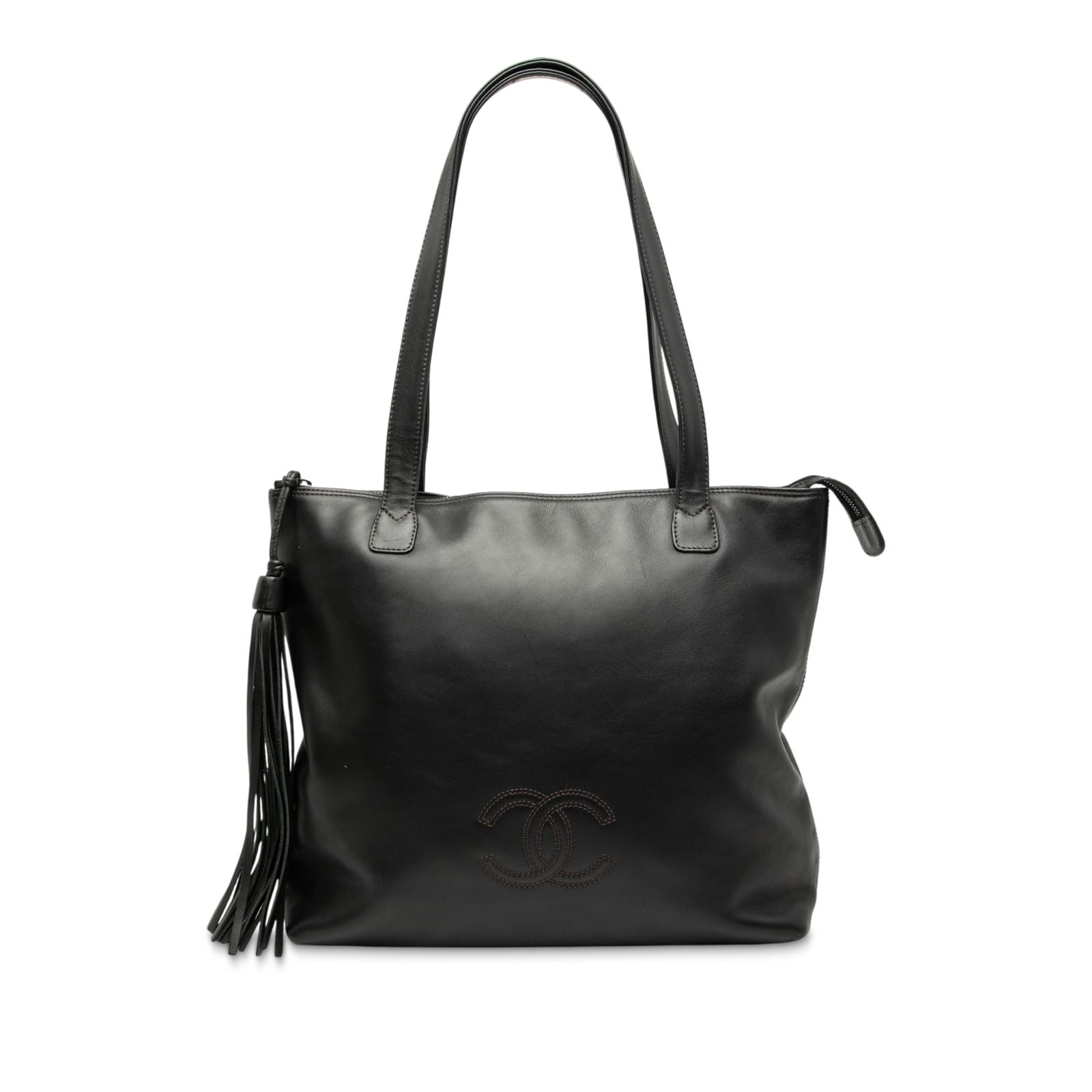 Black Chanel Lambskin Leather Tote with CC Logo and Tassel Detail: Black Chanel Lambskin Leather Tote with CC Logo and Tassel Detail This Chanel CC Lambskin Tassel Tote features a black leather body with a tassel detail, flat leather shoulder straps, a top zip closur