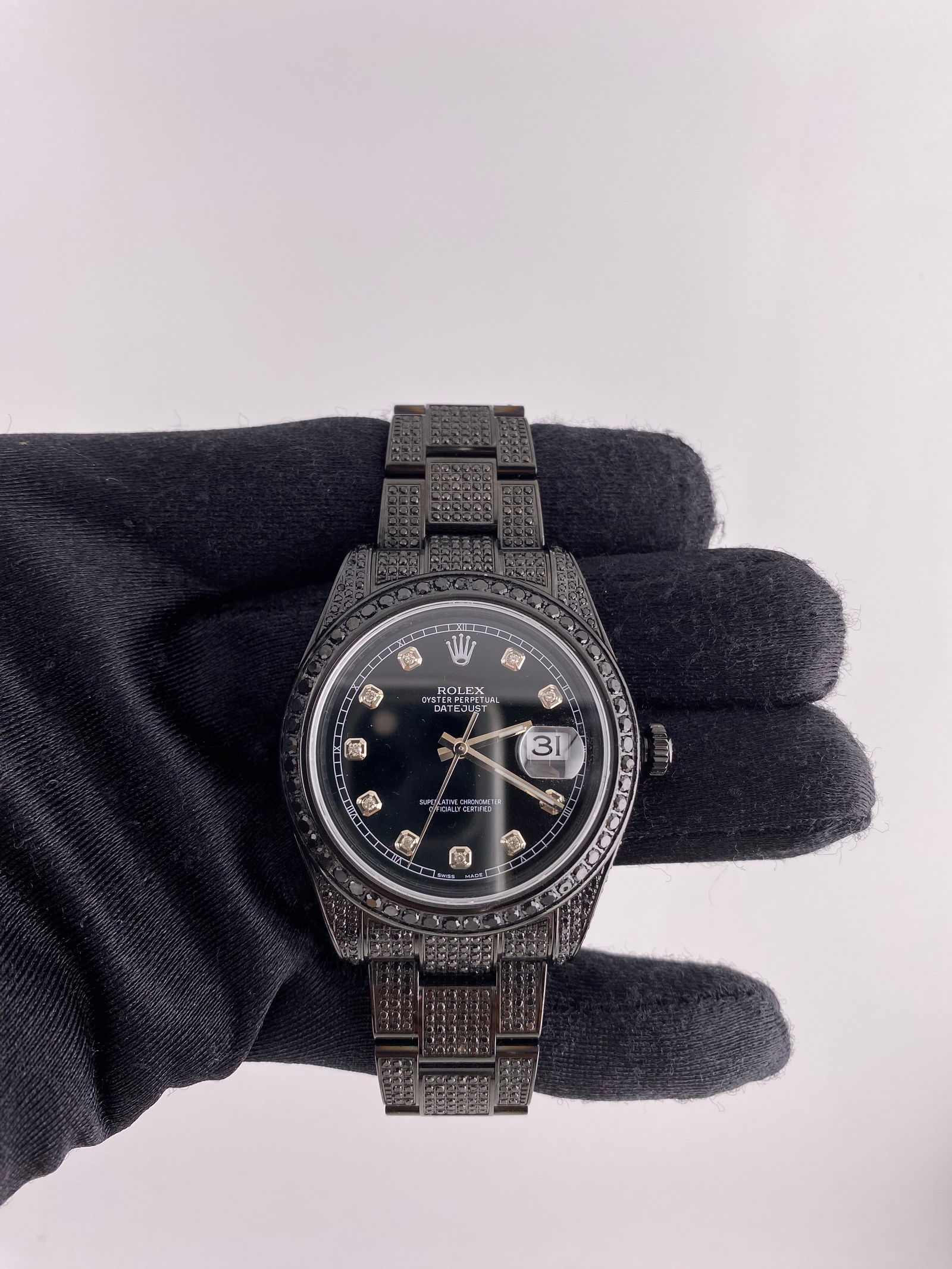 Iced Out Oyster Bracelet Mens Rolex Datejust 116300 with Aftermarket Black Diamond Dial: Iced Out Oyster Bracelet Mens Rolex Datejust 116300 with Aftermarket Black Diamond Dial This men's Rolex Datejust features an aftermarket black diamond dial, a pave diamond bezel, and an Oyster bracel