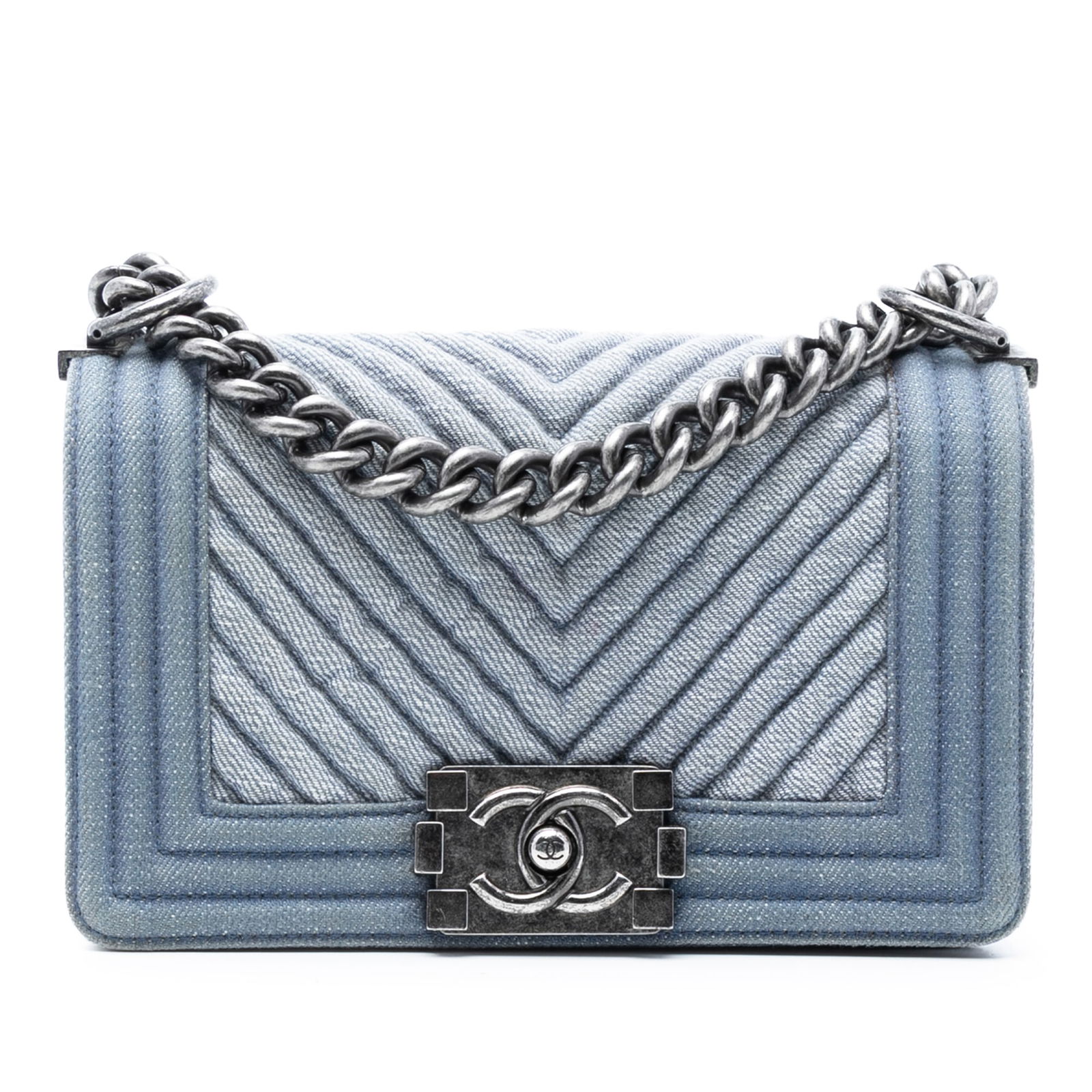 Small Chevron Blue Denim Boy Flap Shoulder Bag by Chanel: Small Chevron Blue Denim Boy Flap Shoulder Bag by Chanel This Chanel Small Chevron Denim Boy Flap bag features a quilted denim exterior with a chevron pattern, a curb chain strap with an adjustable fl