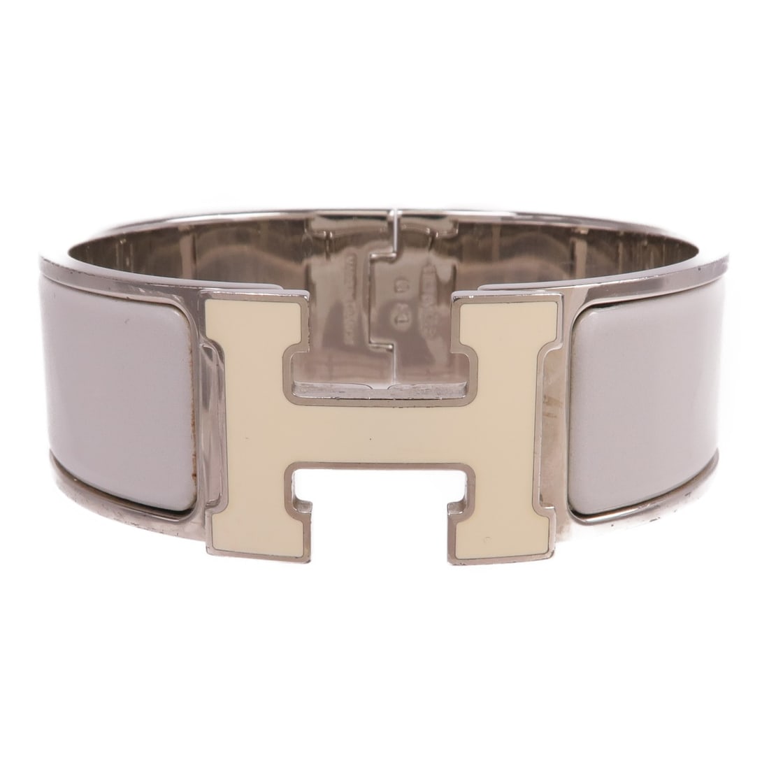 Gray Hermes Clic Clac H Enamel and Metal Fashion Bracelet: Gray Hermes Clic Clac H Enamel and Metal Fashion Bracelet This Hermes Clic Clac H bracelet features a gray enamel finish with metal accents. Made in France, it is designed in a regular size and does n
