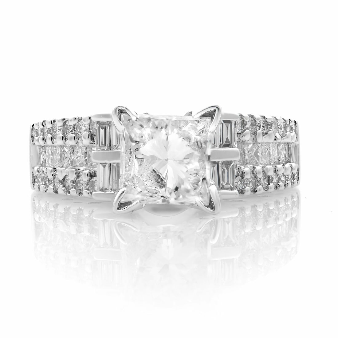 Rachel Koen 18K White Gold Engagement Ring with 1.25ct Princess & Baguette Diamonds: Rachel Koen 18K White Gold Engagement Ring with 1.25ct Princess & Baguette Diamonds This exquisite engagement ring by Rachel Koen showcases a stunning 1.25-carat princess cut diamond at its center, su