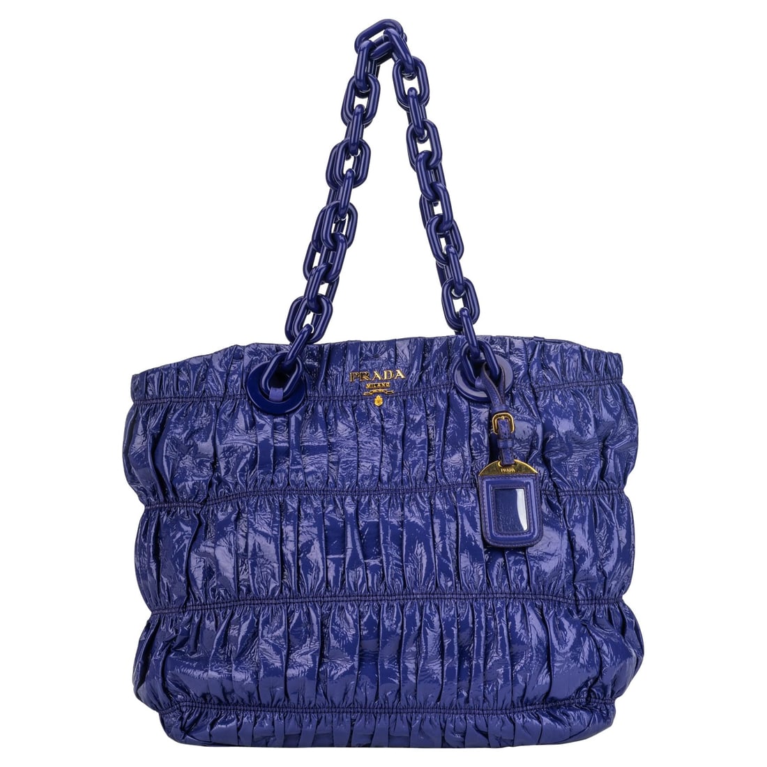 Prada Purple Patent Leather Tote with Oversized Chain: Prada Purple Patent Leather Tote with Oversized Chain This stunning tote bag by Prada showcases a vibrant purple hue and is crafted from high-quality patent leather. Its spacious design features a hei