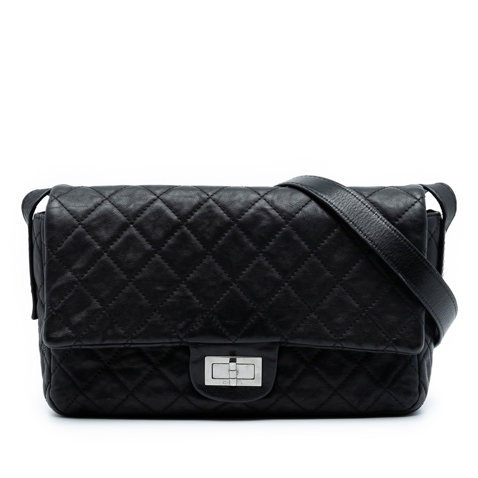 Black Leather Chanel Reissue 2.55 Easy Messenger Crossbody Bag: Black Leather Chanel Reissue 2.55 Easy Messenger Crossbody Bag This Chanel Quilted Calfskin Reissue 2.55 Easy Messenger Flap is crafted from black leather and features a quilted design with an adjusta