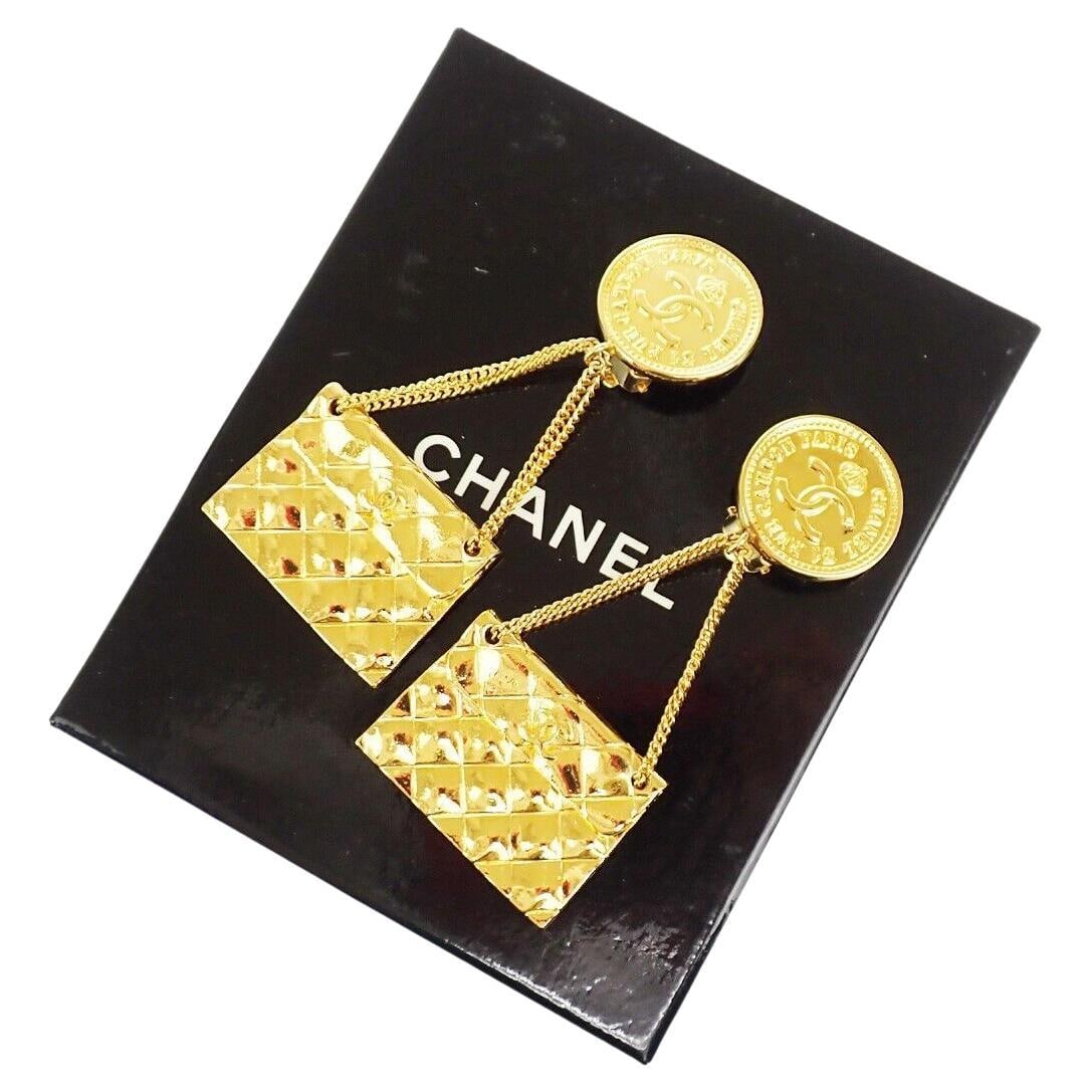 1980s Chanel Dangle Flap Earrings by Victoire de Castellaine with Box: 1980s Chanel Dangle Flap Earrings by Victoire de Castellaine with Box Showcasing a stunning design from the iconic 1980s, these original Chanel dangle flap earrings are a true statement piece. Crafted