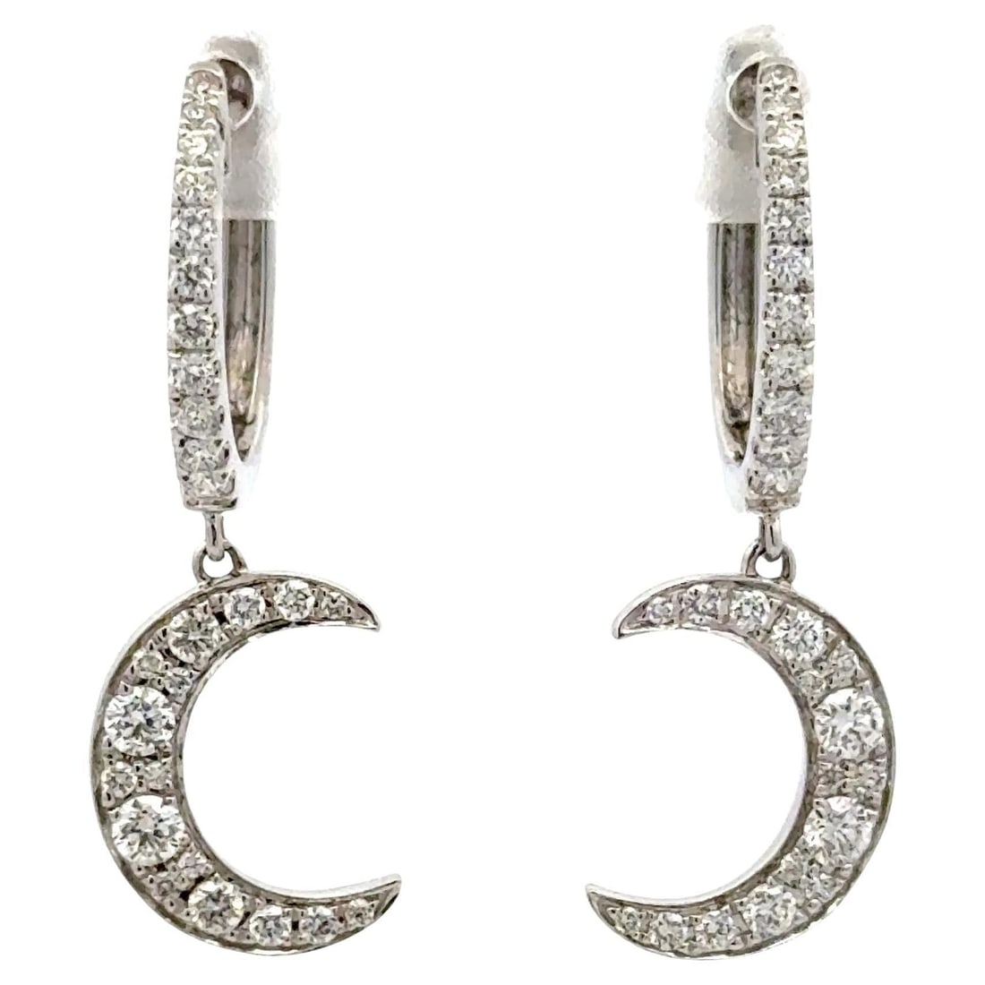 Harbor Diamonds 18KT White Gold Crescent Moon Diamond Earrings 0.60ct: Harbor Diamonds 18KT White Gold Crescent Moon Diamond Earrings 0.60ct These exquisite 18KT white gold hoop drop earrings feature a stunning Crescent Moon dangle design, adorned with 54 round brilliant
