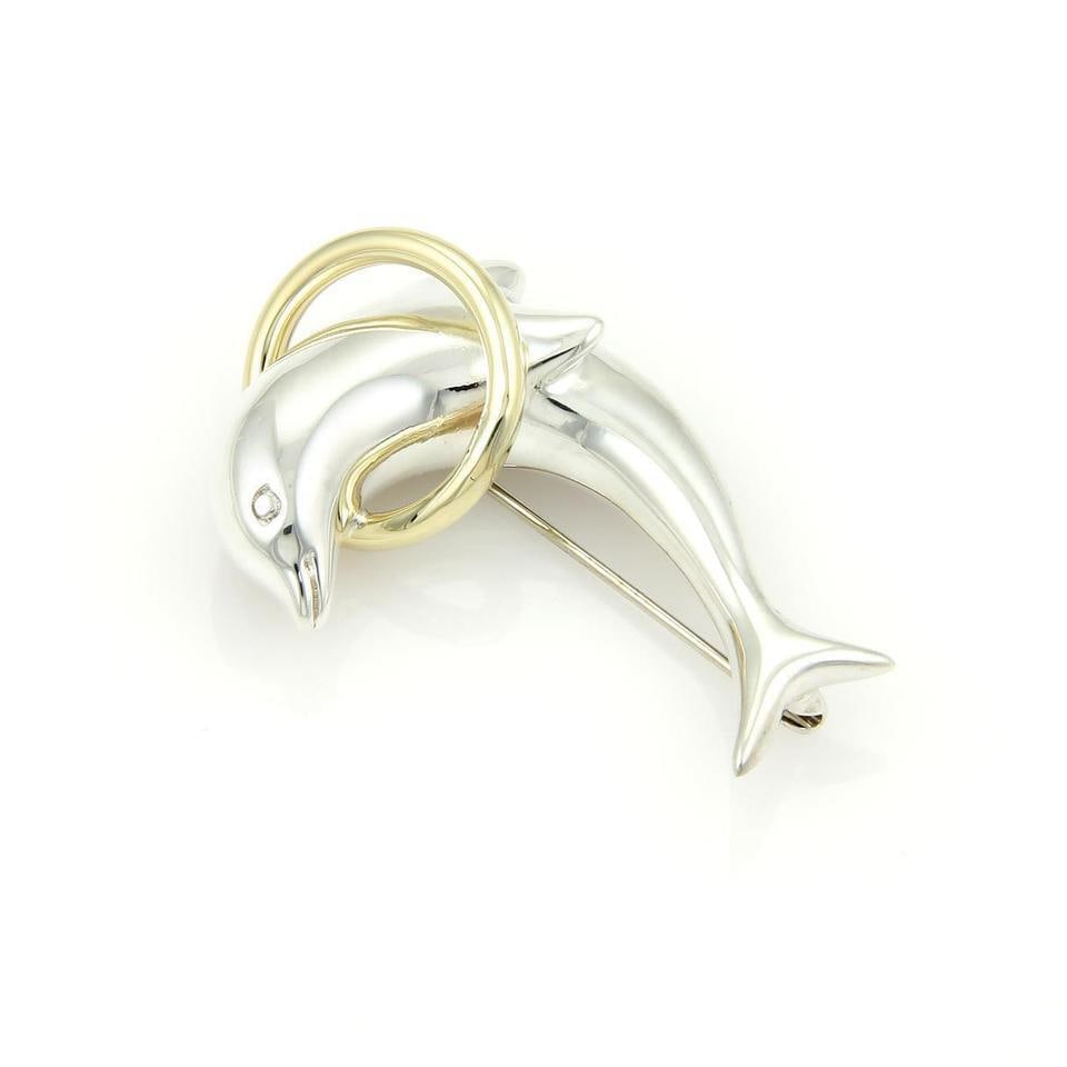 Tiffany & Co. Vintage Dolphin Hoop Brooch 18k Gold Sterling Silver: Tiffany & Co. Vintage Dolphin Hoop Brooch 18k Gold Sterling Silver Add a touch of elegance to your collection with this Tiffany & Co. Vintage Dolphin Hoop Brooch. Expertly crafted from 18k yellow gold