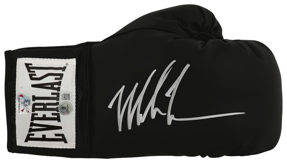 Mike Tyson Signed Everlast Boxing Glove with Beckett COA: Mike Tyson Signed Everlast Boxing Glove with Beckett COA Own a piece of boxing history with this Mike Tyson signed Everlast black boxing glove. This original item features the legendary heavyweight ch