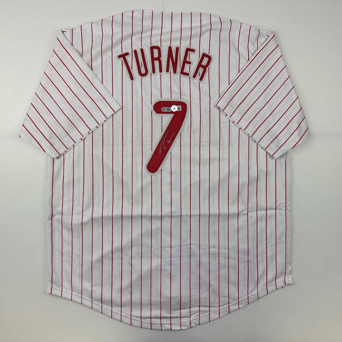 Trea Turner Autographed Philadelphia Phillies Pinstripe Jersey Beckett COA: Trea Turner Autographed Philadelphia Phillies Pinstripe Jersey Beckett COA Celebrate your love for baseball with this authentic autographed Trea Turner Philadelphia Pinstripe Jersey. This unique colle