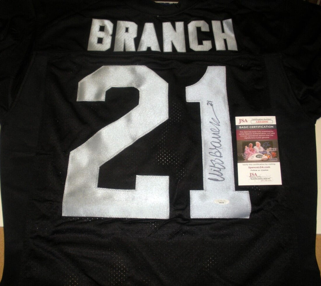 Cliff Branch Signed Oakland Raiders Wilson Jersey with JSA COA: Cliff Branch Signed Oakland Raiders Wilson Jersey with JSA COA This officially licensed Wilson jersey, signed by NFL legend Cliff Branch, is a must-have for any Oakland Raiders fan. The jersey showcas