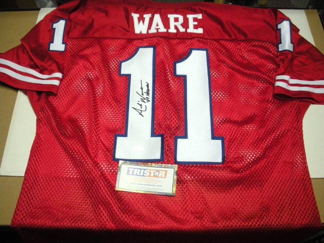 Andre Ware Houston Cougars Signed Official Wilson Jersey: Andre Ware Houston Cougars Signed Official Wilson Jersey This official licensed Wilson jersey features the signature of Andre Ware, a celebrated player from the Houston Cougars football team. The jers