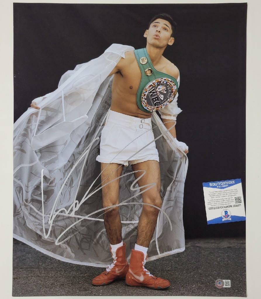 Ryan Garcia Signed 16x20 Boxing Photo Beckett BAS COA: Ryan Garcia Signed 16x20 Boxing Photo Beckett BAS COA This is an authentic 16x20 photo of boxing star Ryan Garcia, signed by the athlete himself. The autograph has been verified by Beckett Authenticat