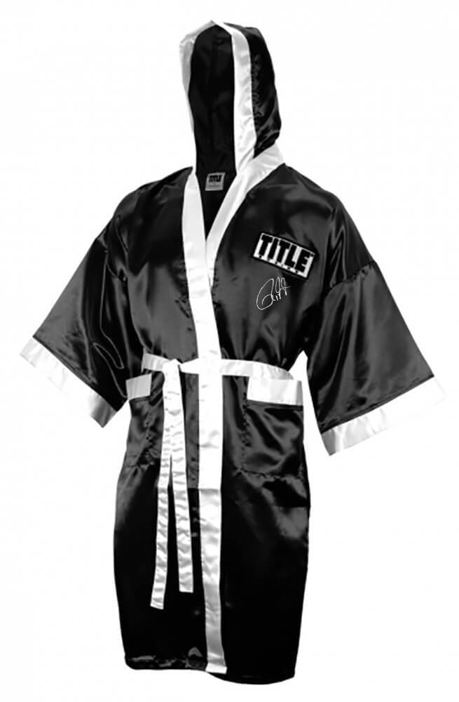 Roy Jones Jr. Signed Title Boxing Robe Hood Black White Trim COA: Roy Jones Jr. Signed Title Boxing Robe Hood Black White Trim COA Celebrate the legacy of boxing with this authentic Roy Jones Jr. signed Title boxing robe, featuring a striking black design with white