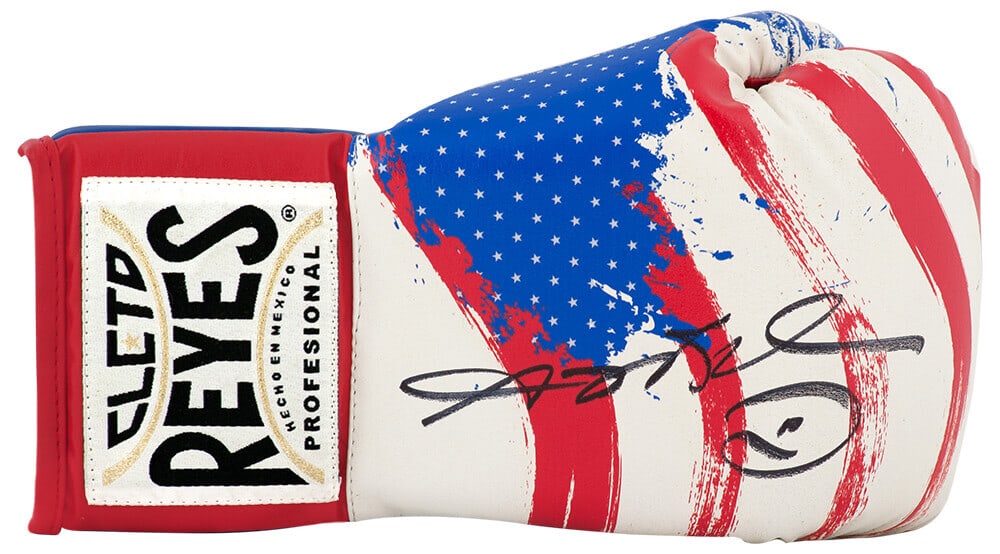 Sugar Ray Leonard Signed Cleteo Reyes USA Boxing Glove with COA: Sugar Ray Leonard Signed Cleteo Reyes USA Boxing Glove with COA This is an authentic Sugar Ray Leonard signed Cleteo Reyes boxing glove, featuring a striking red, white, and blue design. The glove is