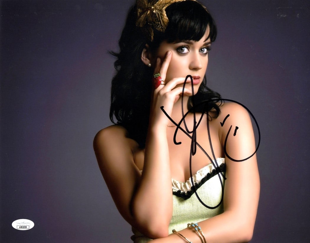 Katy Perry Signed 11x14 Photo with Butterfly JSA Authenticated: Katy Perry Signed 11x14 Photo with Butterfly JSA Authenticated This stunning 11x14 photograph of Katy Perry features her signature, making it a must-have for any fan. The photo showcases a captivating
