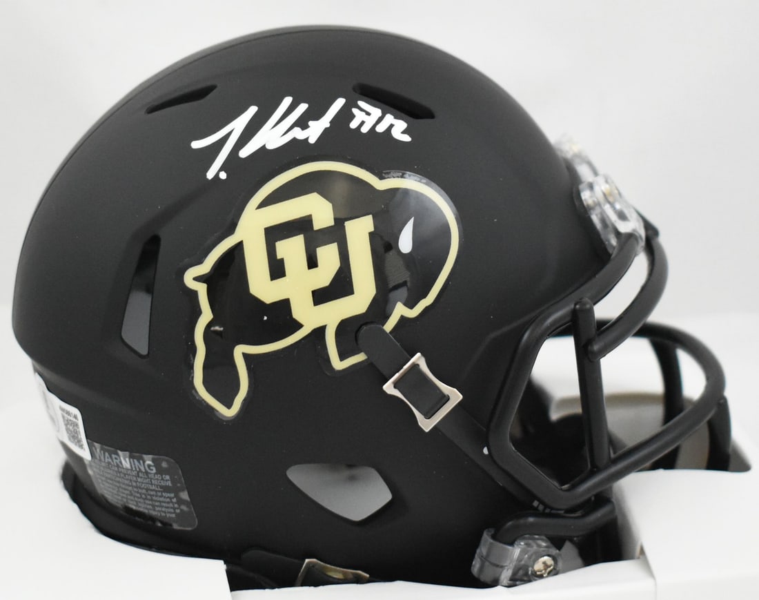 Travis Hunter Signed Colorado Buffaloes Mini Helmet Beckett Authenticated: Travis Hunter Signed Colorado Buffaloes Mini Helmet Beckett Authenticated This authentic mini helmet is a must-have for fans of Travis Hunter and the Colorado Buffaloes. It features a signature from t