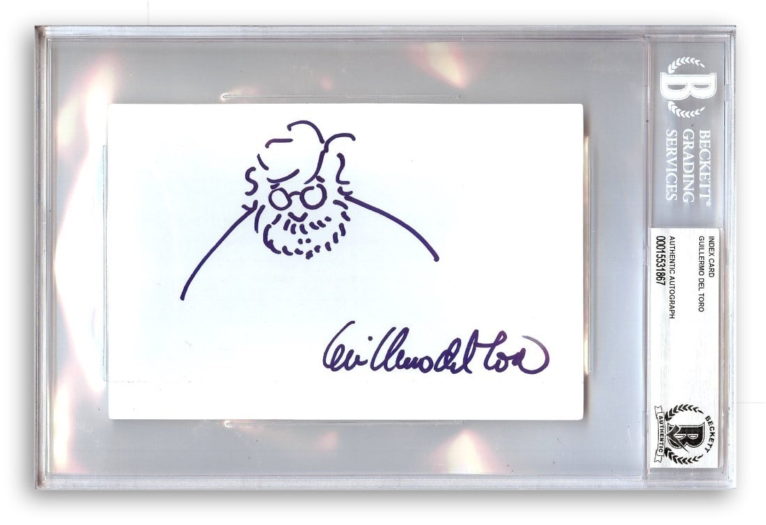Guillermo Del Toro Signed Index Card with Self Sketch Beckett Authenticated: Guillermo Del Toro Signed Index Card with Self Sketch Beckett Authenticated This is an original autographed index card by acclaimed director Guillermo Del Toro, featuring a self-sketch. The index card