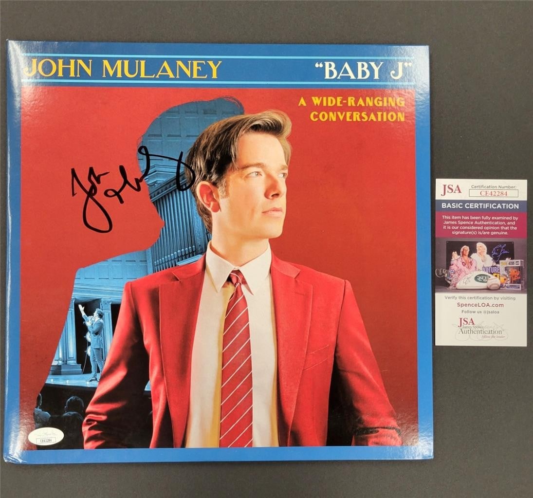 John Mulaney Signed Baby J Vinyl Cover with JSA Authentication: John Mulaney Signed Baby J Vinyl Cover with JSA Authentication This unique collectible features a signed vinyl record cover of 'Baby J' by comedian John Mulaney. The vinyl cover showcases Mulaney's si