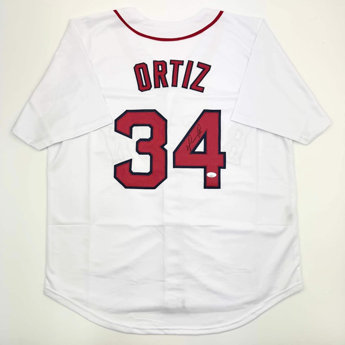 David Ortiz Signed Custom White Baseball Jersey Beckett Authenticated: David Ortiz Signed Custom White Baseball Jersey Beckett Authenticated This is a custom white Boston baseball jersey autographed by David Ortiz. The jersey features the player's name and number and is