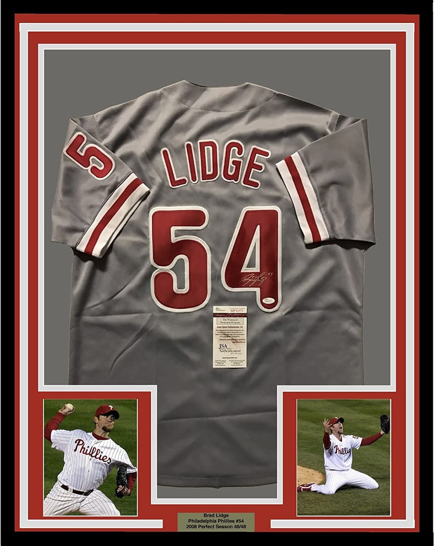 Framed Autographed Brad Lidge Jersey 33x42 with JSA COA: Framed Autographed Brad Lidge Jersey 33x42 with JSA COA Elevate your sports memorabilia collection with this professionally framed and autographed Brad Lidge jersey. This stunning 33"x42" Philadelphia