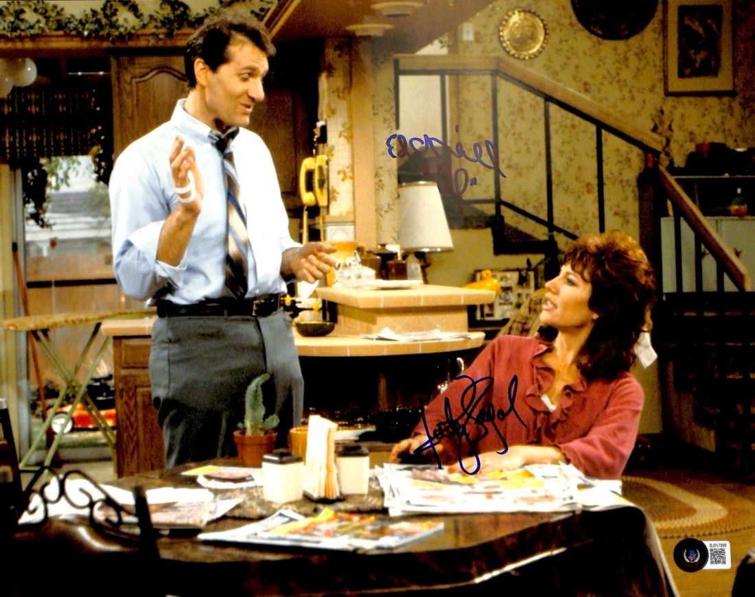 Katey Sagal Ed O'Neill Signed 11x14 Married With Children Photo Beckett Authenticated: Katey Sagal Ed O'Neill Signed 11x14 Married With Children Photo Beckett Authenticated This is an authentic autographed 11x14 photograph featuring Ed O'Neill as "Al Bundy" and Katey Sagal as "Peggy Bun