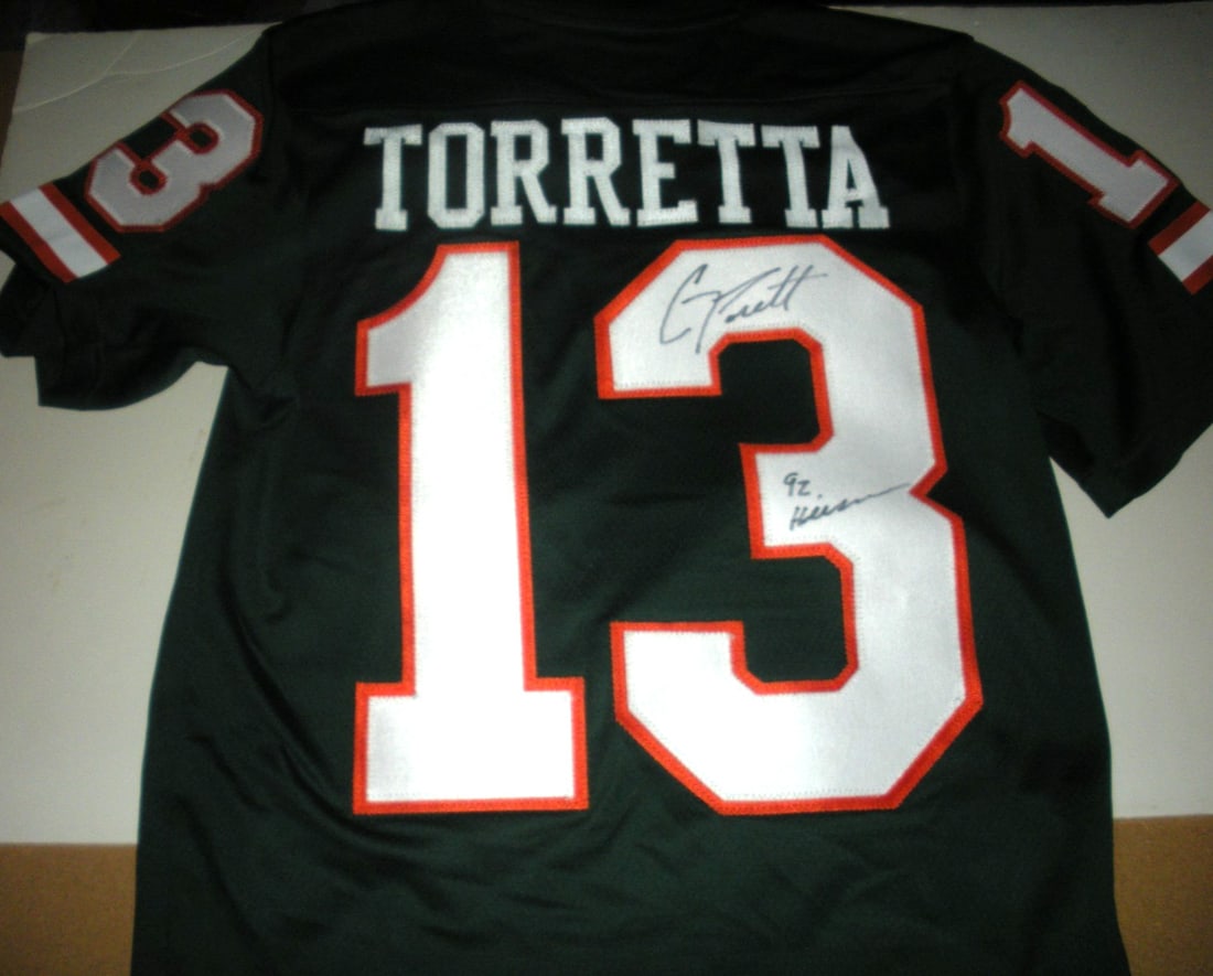 GINO TORRETTA Miami Hurricanes Signed Adidas Jersey with COA: GINO TORRETTA Miami Hurricanes Signed Adidas Jersey with COA Showcase your Miami Hurricanes pride with this officially licensed Adidas jersey signed by Gino Torretta. This authentic piece is perfect f