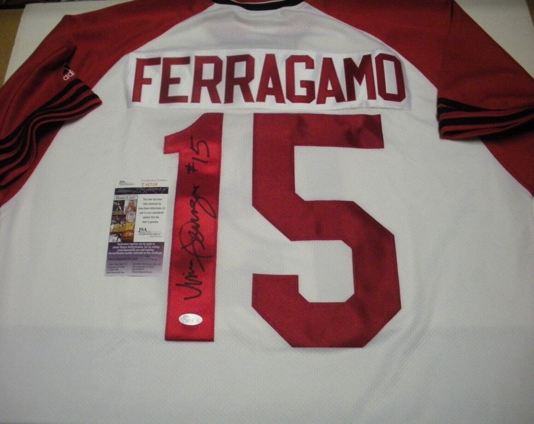 Vince Ferragamo Signed Nebraska Huskers Adidas Jersey with JSA COA: Vince Ferragamo Signed Nebraska Huskers Adidas Jersey with JSA COA This is an officially licensed Adidas jersey signed by Vince Ferragamo, a prominent figure in NFL football. The jersey is a tribute t