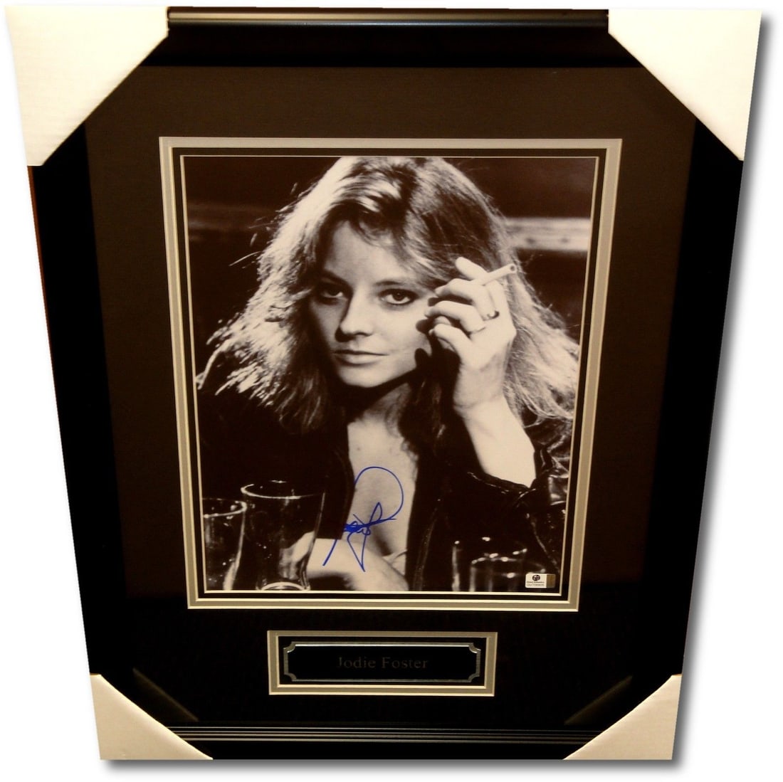 Jodie Foster Signed 11x14 Framed Photo B&W Smoking Global Authentics: Jodie Foster Signed 11x14 Framed Photo B&W Smoking Global Authentics This stunning 11x14 custom framed photograph features the iconic Jodie Foster, signed by the actress herself. The black and white i