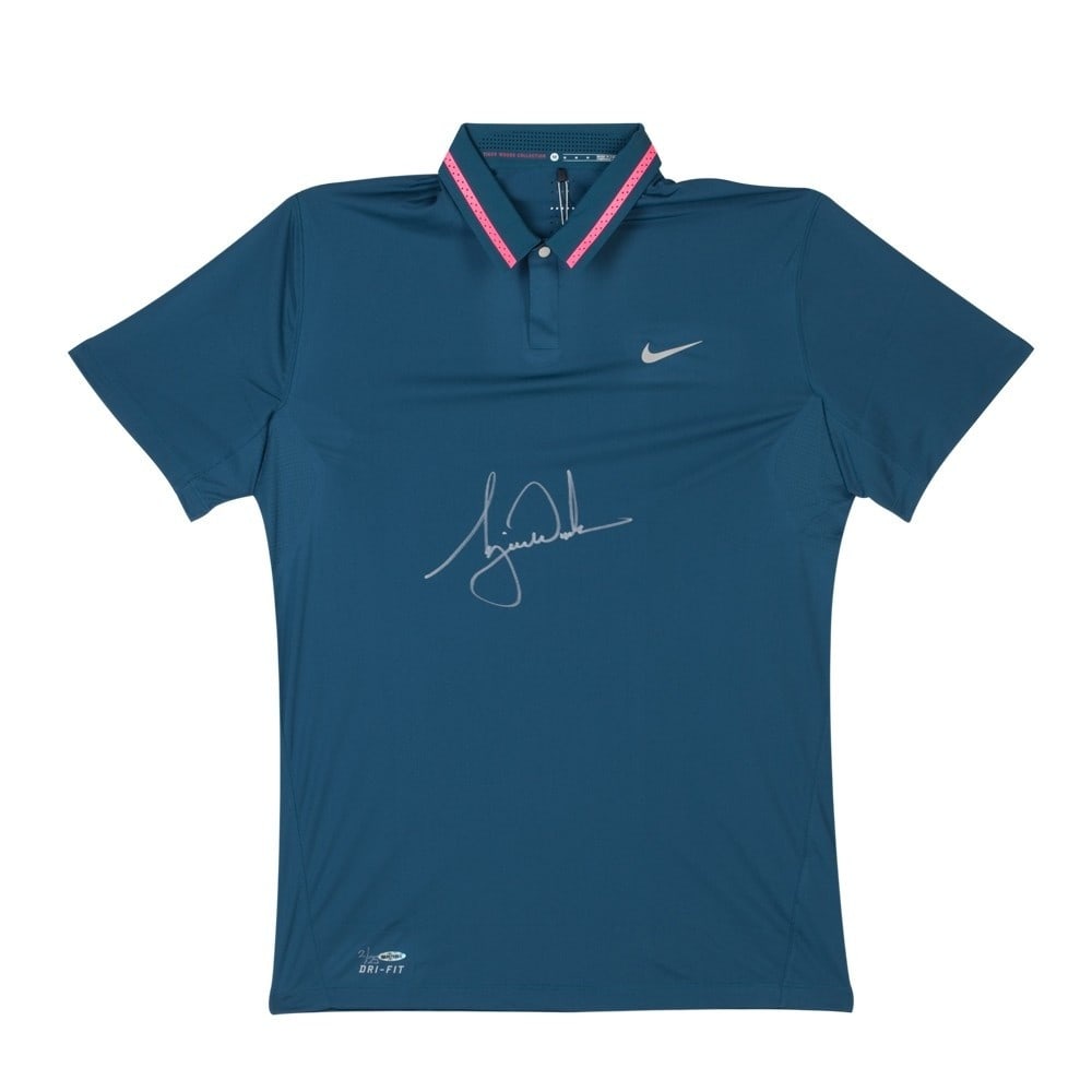 Limited Edition Tiger Woods Signed Nike Polo Shirt UDA: Limited Edition Tiger Woods Signed Nike Polo Shirt UDA This authentic Nike Space Blue polo shirt is autographed by the legendary golfer Tiger Woods. Limited to only 25 pieces, this collectible item co