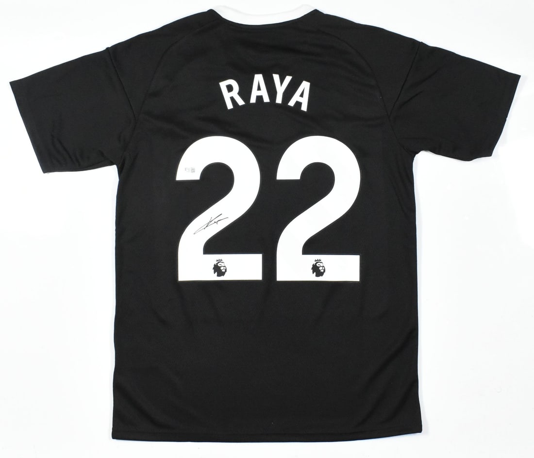 David Raya Arsenal FC Signed Goalkeeper Jersey #22 Beckett Hologram: David Raya Arsenal FC Signed Goalkeeper Jersey #22 Beckett Hologram Showcase your support for Arsenal FC with this authentic goalkeeper jersey signed by David Raya, featuring the player number 22. Thi