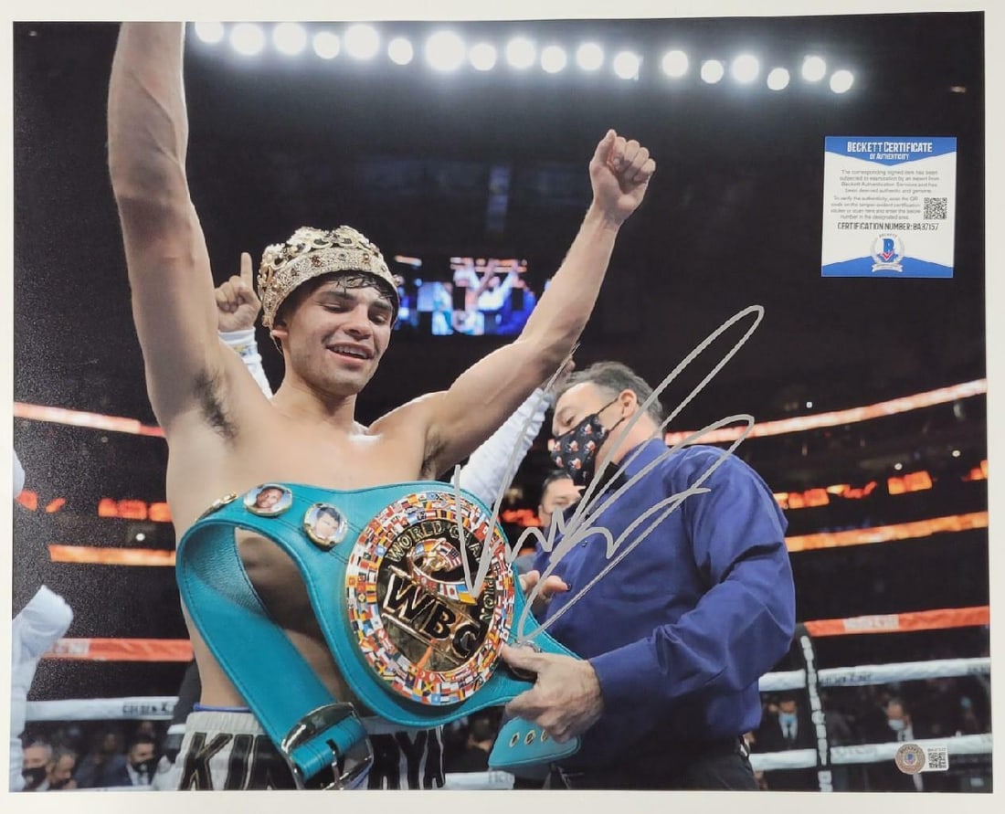 Ryan Garcia Signed 16x20 Boxing Photo Beckett Authenticated: Ryan Garcia Signed 16x20 Boxing Photo Beckett Authenticated This is an original 16x20 photo of Ryan Garcia, a prominent figure in boxing, featuring his authentic autograph. The photograph has been aut