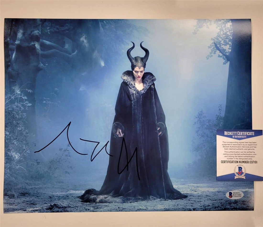 Angelina Jolie Maleficent 11x14 Signed Photo Beckett COA: Angelina Jolie Maleficent 11x14 Signed Photo Beckett COA This captivating 11x14 photograph of Angelina Jolie as Maleficent features her authentic signature, making it a perfect collectible for fans of