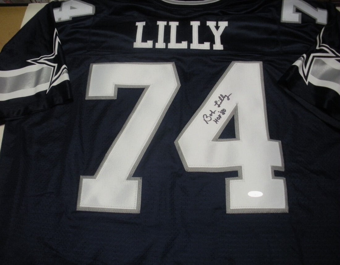 Bob Lilly Signed Dallas Cowboys Proline Jersey with COA: Bob Lilly Signed Dallas Cowboys Proline Jersey with COA This is an officially licensed ProLine jersey from the Dallas Cowboys, signed by legendary linebacker Bob Lilly. The jersey showcases the team's