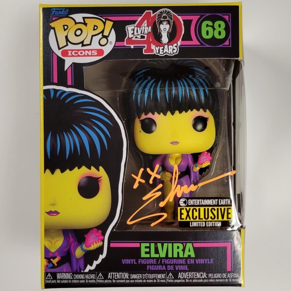 Elvira Signed Black Light Funko Pop BAS Authentication: Elvira Signed Black Light Funko Pop BAS Authentication This is an original black light Funko Pop figure featuring the iconic character Elvira, signed by the actress herself. The autograph comes with a