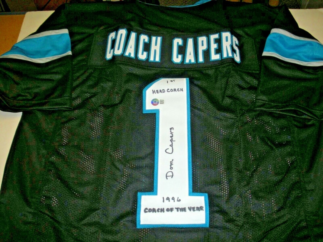 Dom Capers Signed Carolina Panthers Jersey Beckett Authenticated: Dom Capers Signed Carolina Panthers Jersey Beckett Authenticated This is an original signed jersey from Dom Capers, featuring the Carolina Panthers. The jersey is a unique piece of memorabilia authent
