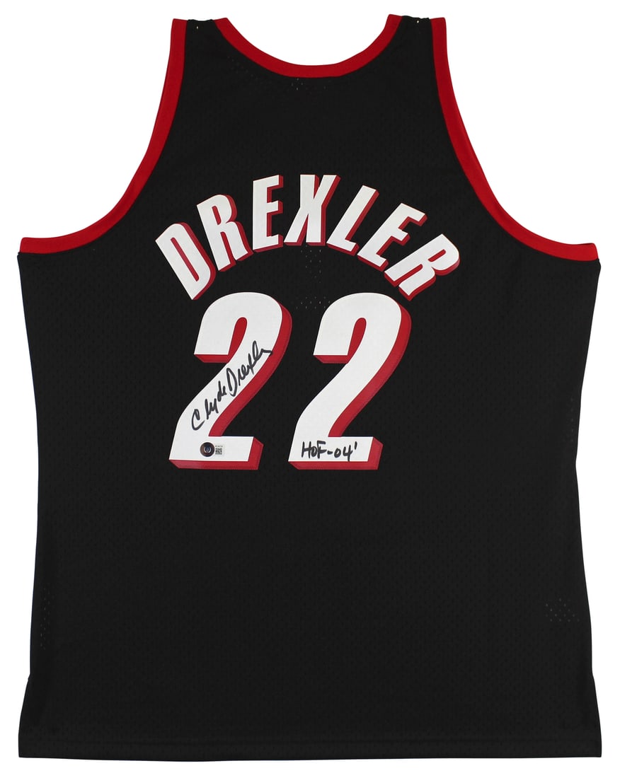 Clyde Drexler Signed Black Mitchell & Ness Jersey HOF 04 Beckett Authenticated: Clyde Drexler Signed Black Mitchell & Ness Jersey HOF 04 Beckett Authenticated This autographed black Mitchell & Ness jersey features the inscription "HOF 04" and has been personally signed by Clyde D