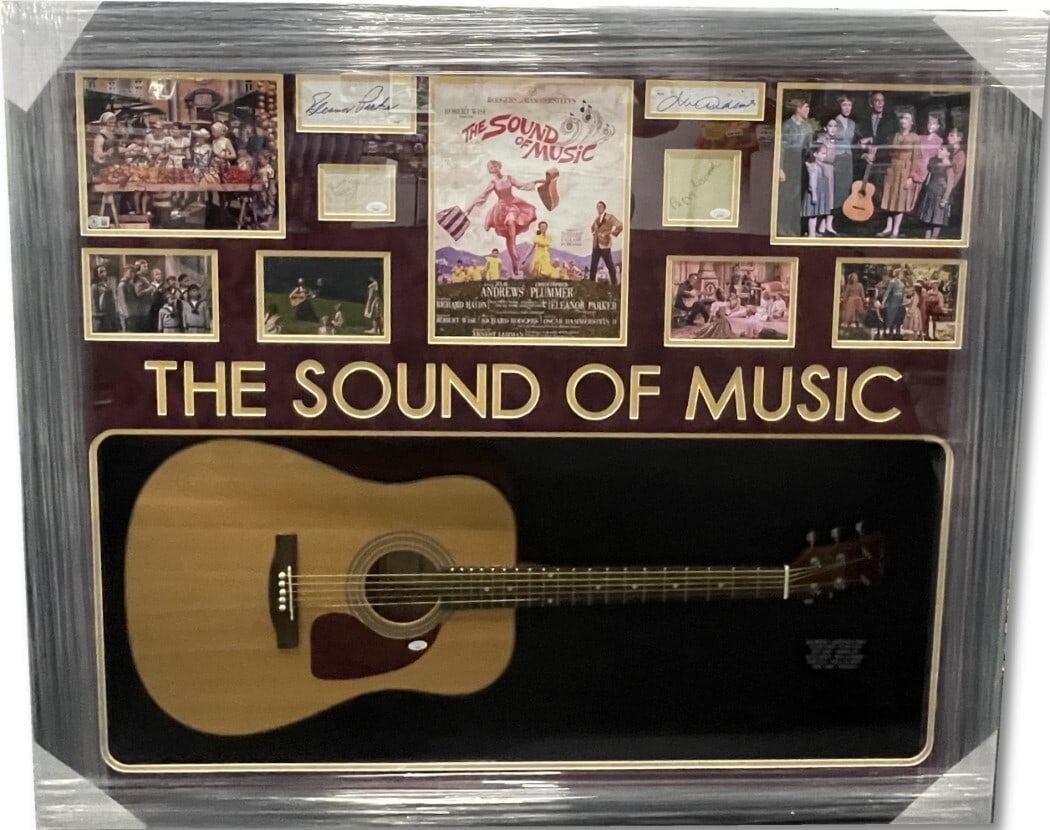 The Sound of Music Cast Autographed Guitar Cut Photo JSA Beckett Certified: The Sound of Music Cast Autographed Guitar Cut Photo JSA Beckett Certified Celebrate the iconic cast of "The Sound of Music" with this stunning autographed guitar cuts photo. This unique piece is ador