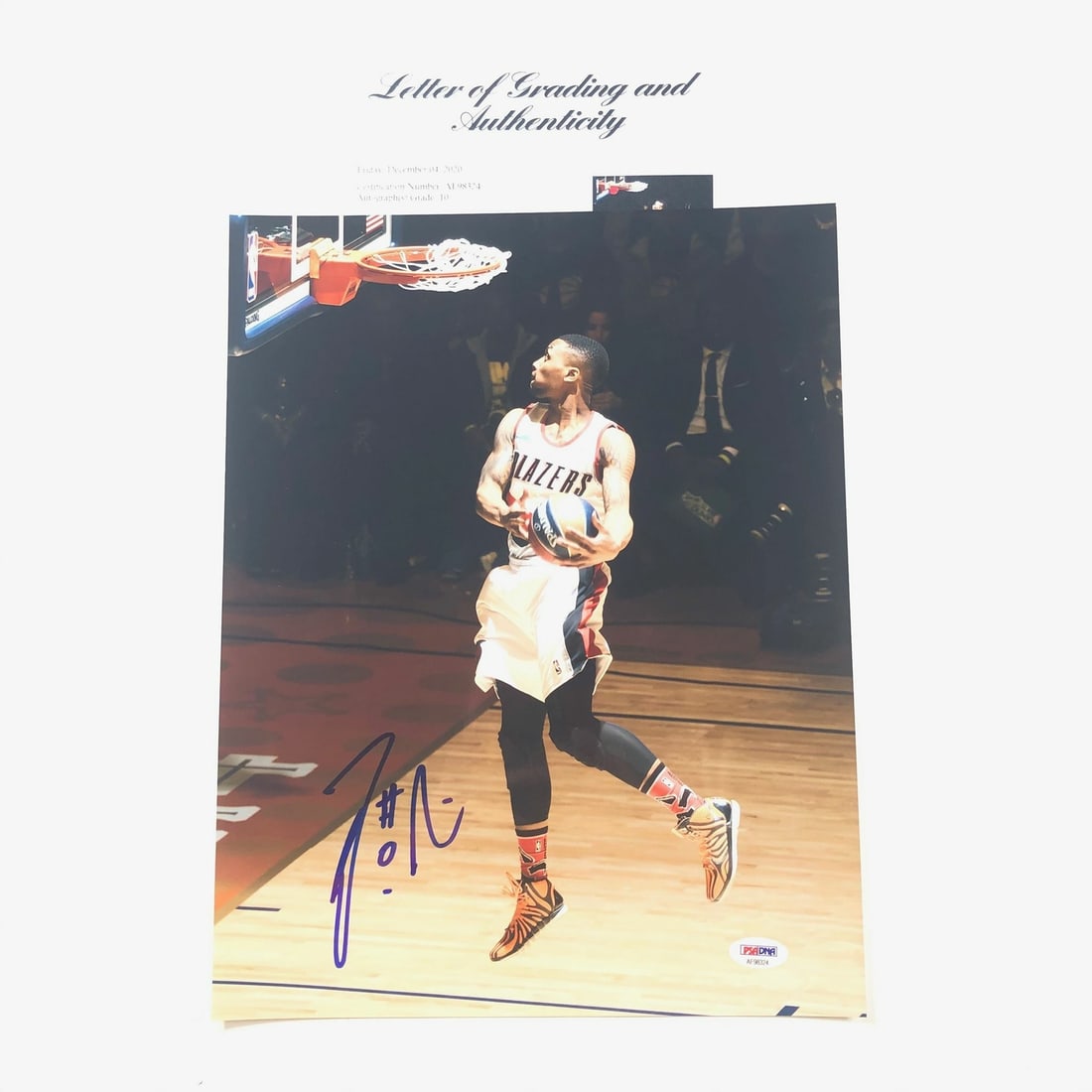 Damian Lillard Signed 11x14 Photo PSA/DNA Grade 10 Trail Blazers: Damian Lillard Signed 11x14 Photo PSA/DNA Grade 10 Trail Blazers This is an original 11x14 photograph signed by Damian Lillard, a prominent player of the Portland Trail Blazers in the NBA. The signatu