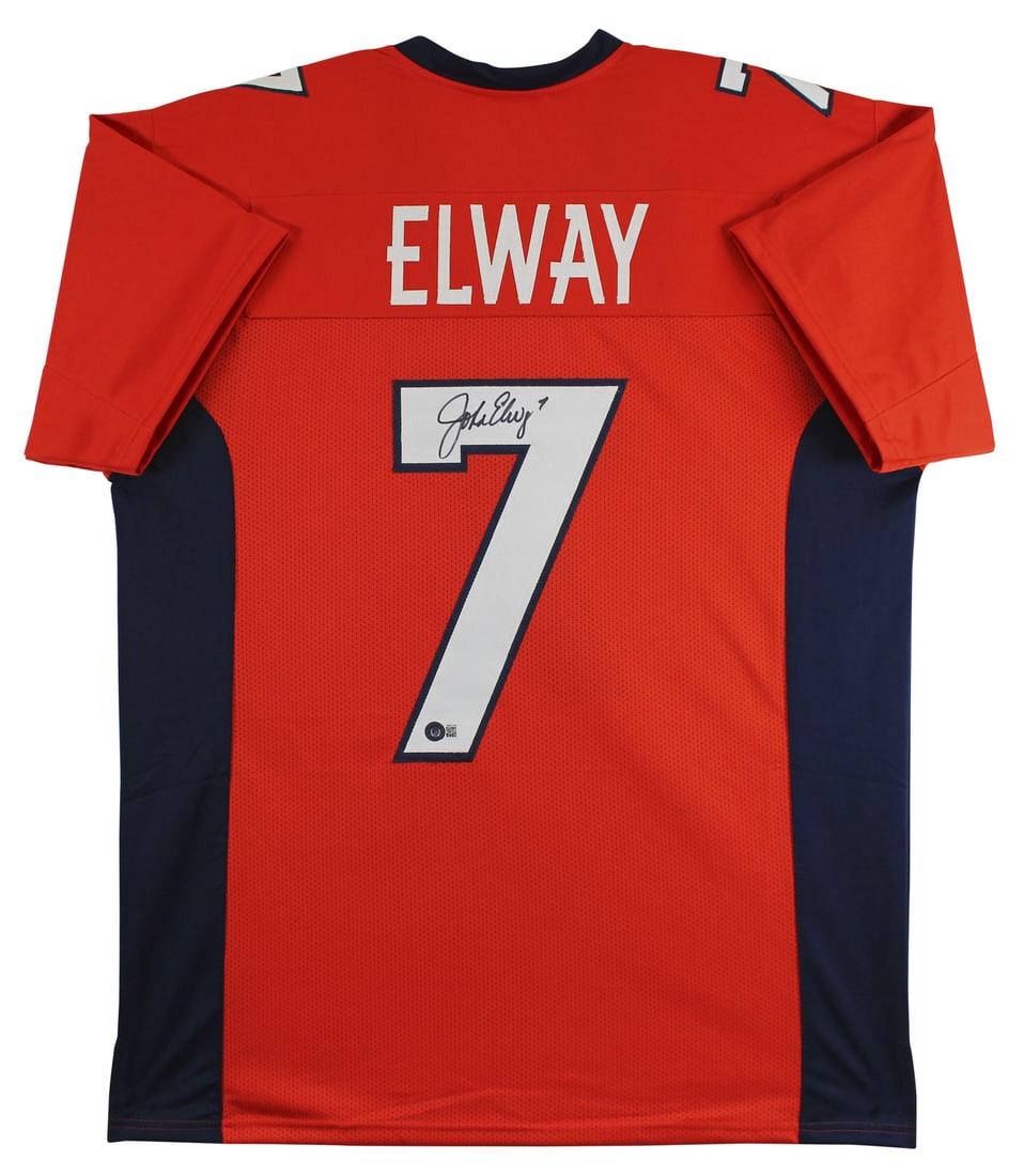 John Elway Signed Denver Broncos Orange/Navy Jersey BAS Witnessed: John Elway Signed Denver Broncos Orange/Navy Jersey BAS Witnessed This authentic Orange/Navy Pro Style Jersey has been personally signed by NFL legend John Elway, showcasing his signature in a unique