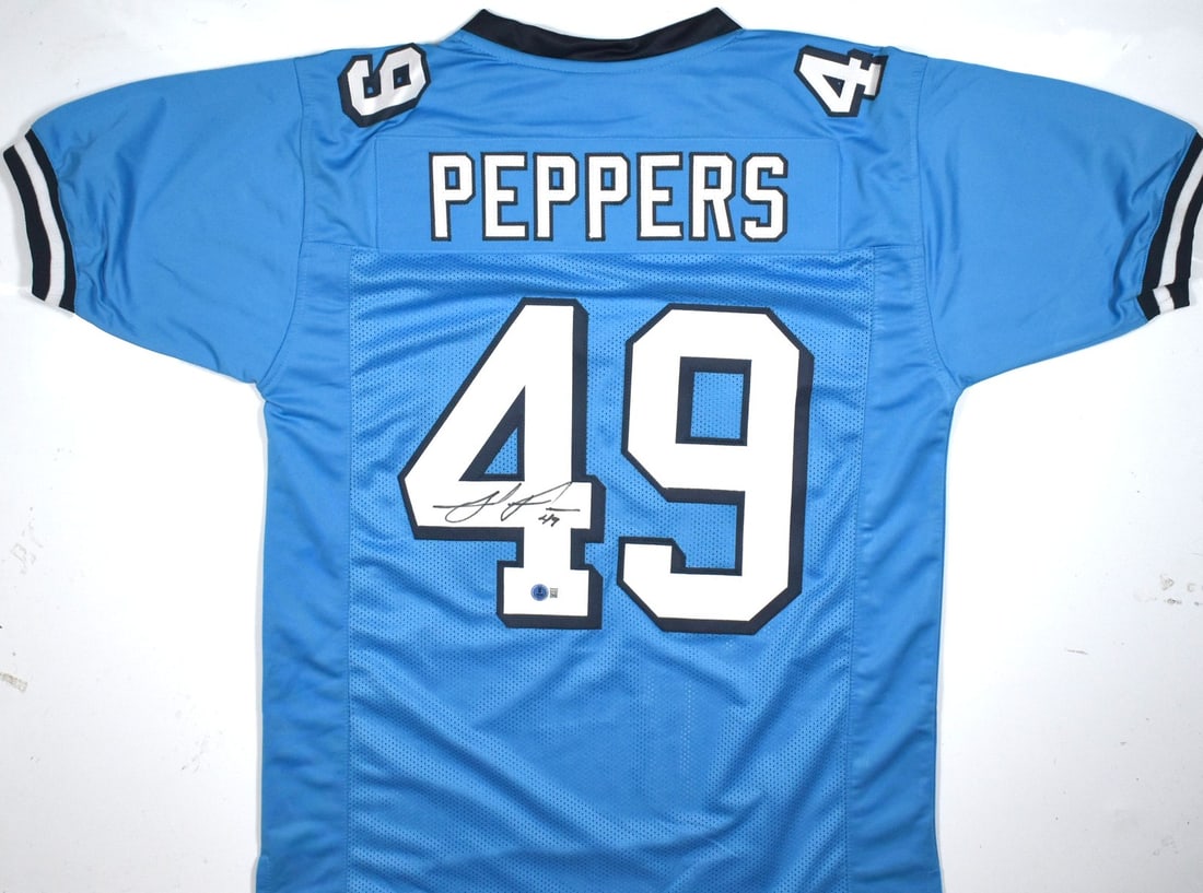 Julius Peppers Signed Tar Heel Blue Jersey Beckett Authenticated: Julius Peppers Signed Tar Heel Blue Jersey Beckett Authenticated This is a pre-owned college style jersey in Tar Heel blue, featuring the iconic colors of the North Carolina Tar Heels. The jersey is a