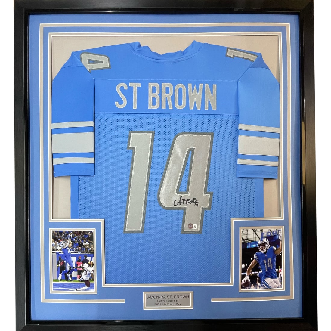 Framed Amon-Ra St. Brown Autographed Detroit Lions Jersey BAS COA: Framed Amon-Ra St. Brown Autographed Detroit Lions Jersey BAS COA This stunning framed piece showcases an autographed blue jersey of Amon-Ra St. Brown, a prominent player for the Detroit Lions. The je