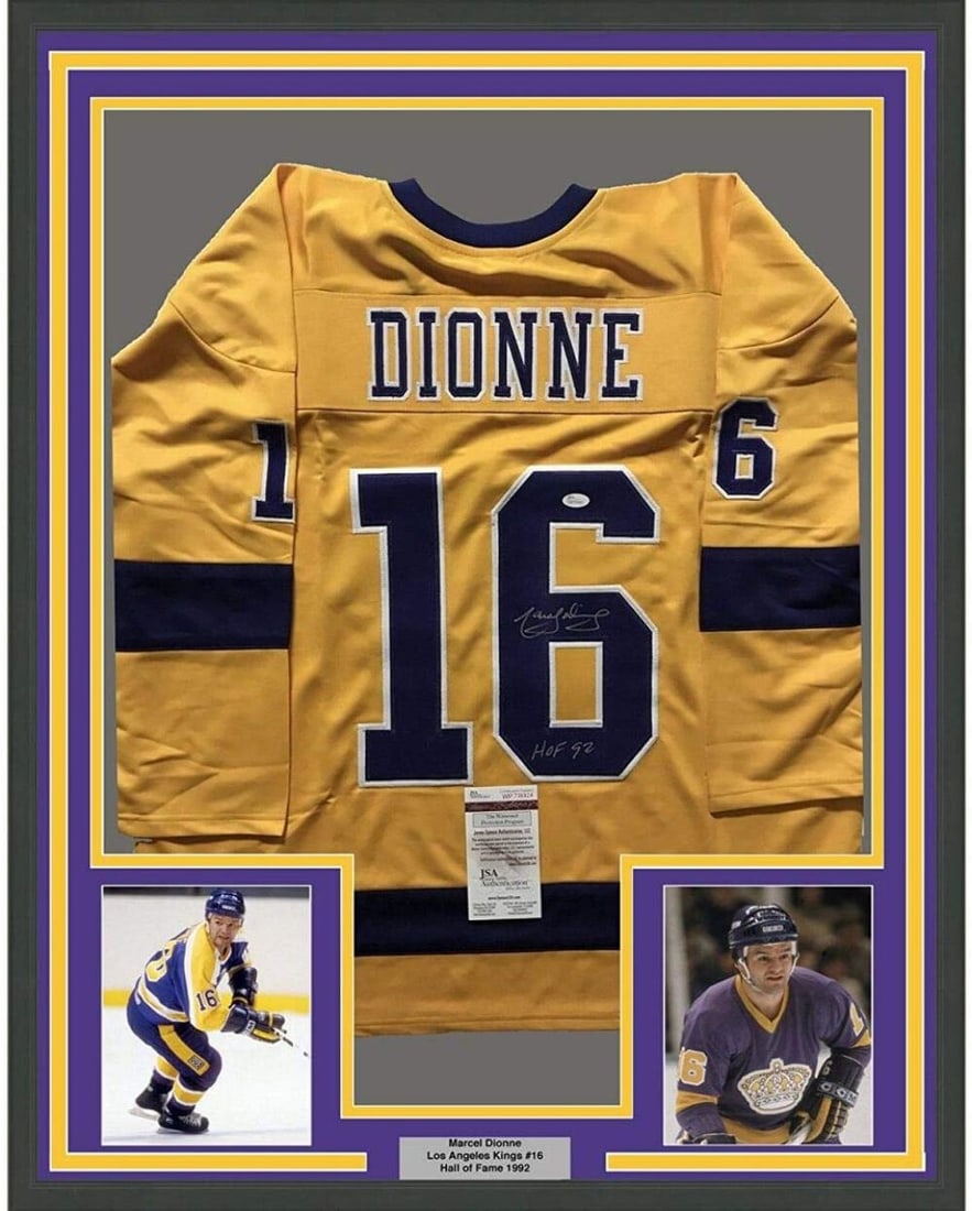 Framed Autographed Marcel Dionne HOF 92 LA Kings Jersey JSA COA 35x39: Framed Autographed Marcel Dionne HOF 92 LA Kings Jersey JSA COA 35x39 Celebrate the legacy of hockey legend Marcel Dionne with this framed and autographed 35x39 LA Kings yellow jersey. The jersey is a