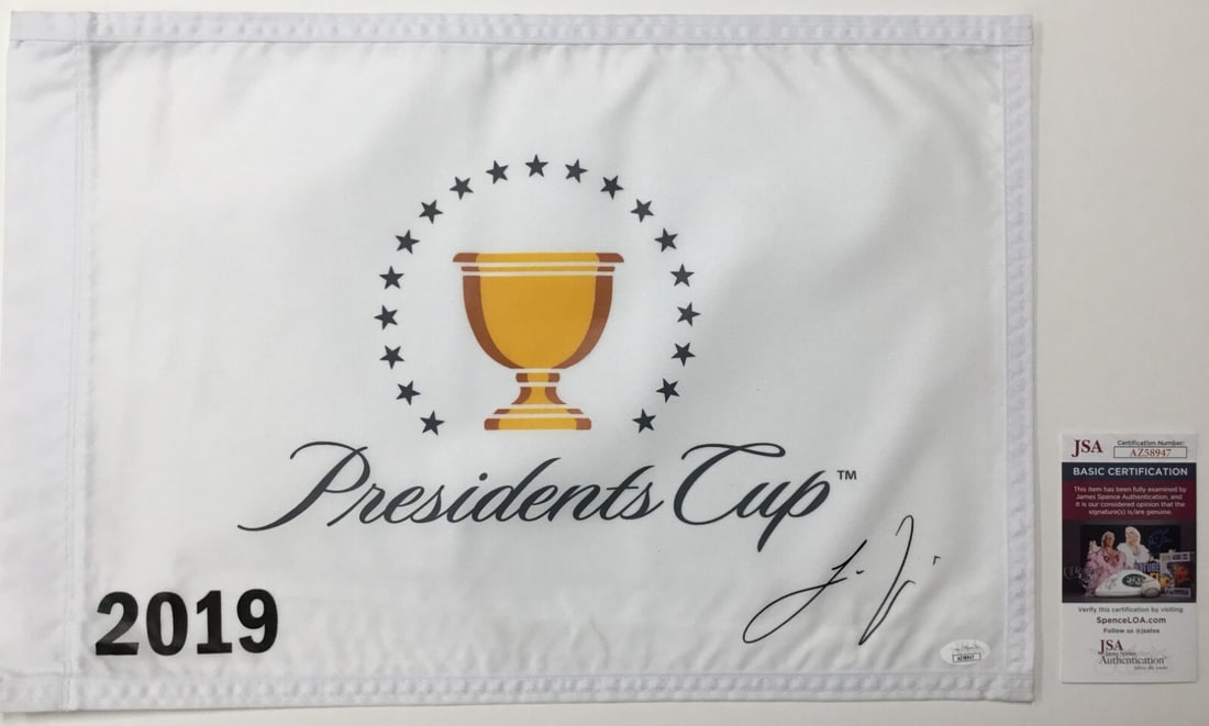 Joaquin Niemann Signed President's Cup 2019 Pin Flag JSA AZ58947: Joaquin Niemann Signed President's Cup 2019 Pin Flag JSA AZ58947 This is an official pin flag from The President's Cup 2019, signed by the talented PGA golfer Joaquin Niemann. The autograph has been a