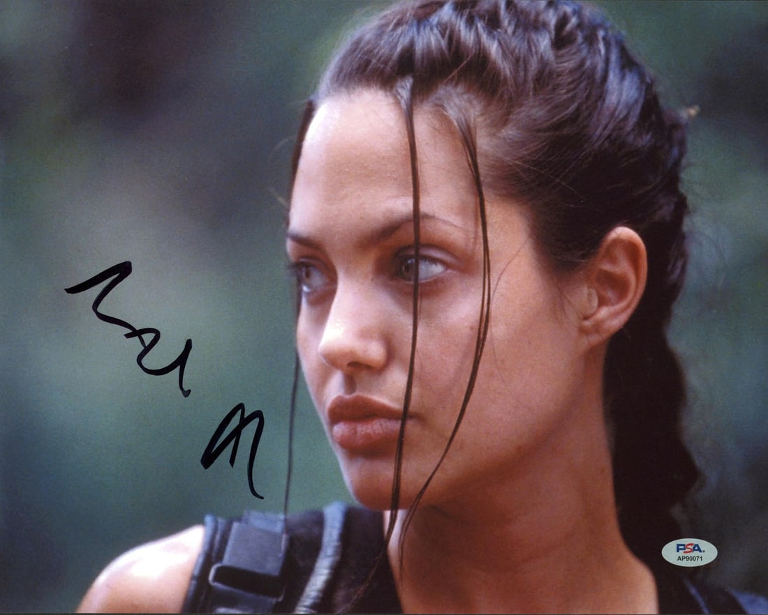 Angelina Jolie Signed Tomb Raider 11x14 Photo PSA Certified: Angelina Jolie Signed Tomb Raider 11x14 Photo PSA Certified This stunning 11x14 horizontal photograph features an authentic signature from Angelina Jolie, renowned for her role in Tomb Raider. Each pi
