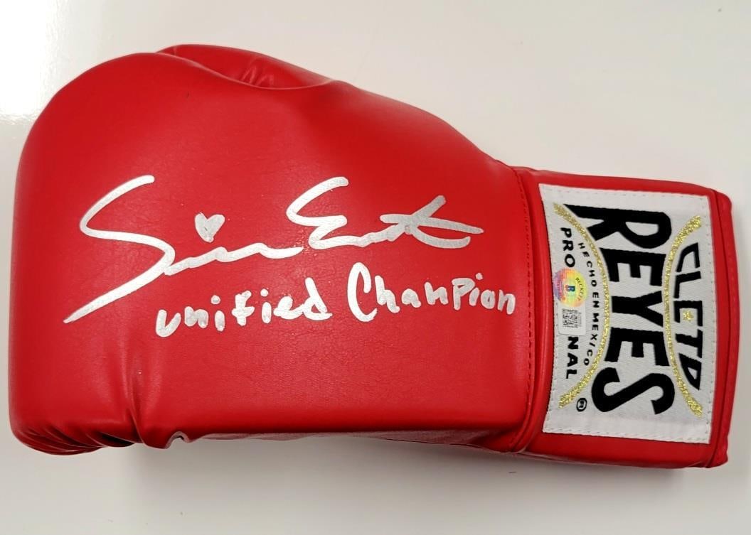 Seniesa Estrada Signed Boxing Glove Unified Champion Beckett BAS: Seniesa Estrada Signed Boxing Glove Unified Champion Beckett BAS This is an original signed boxing glove by Seniesa Estrada, authenticated by Beckett Authentication Services (BAS). The glove showcases