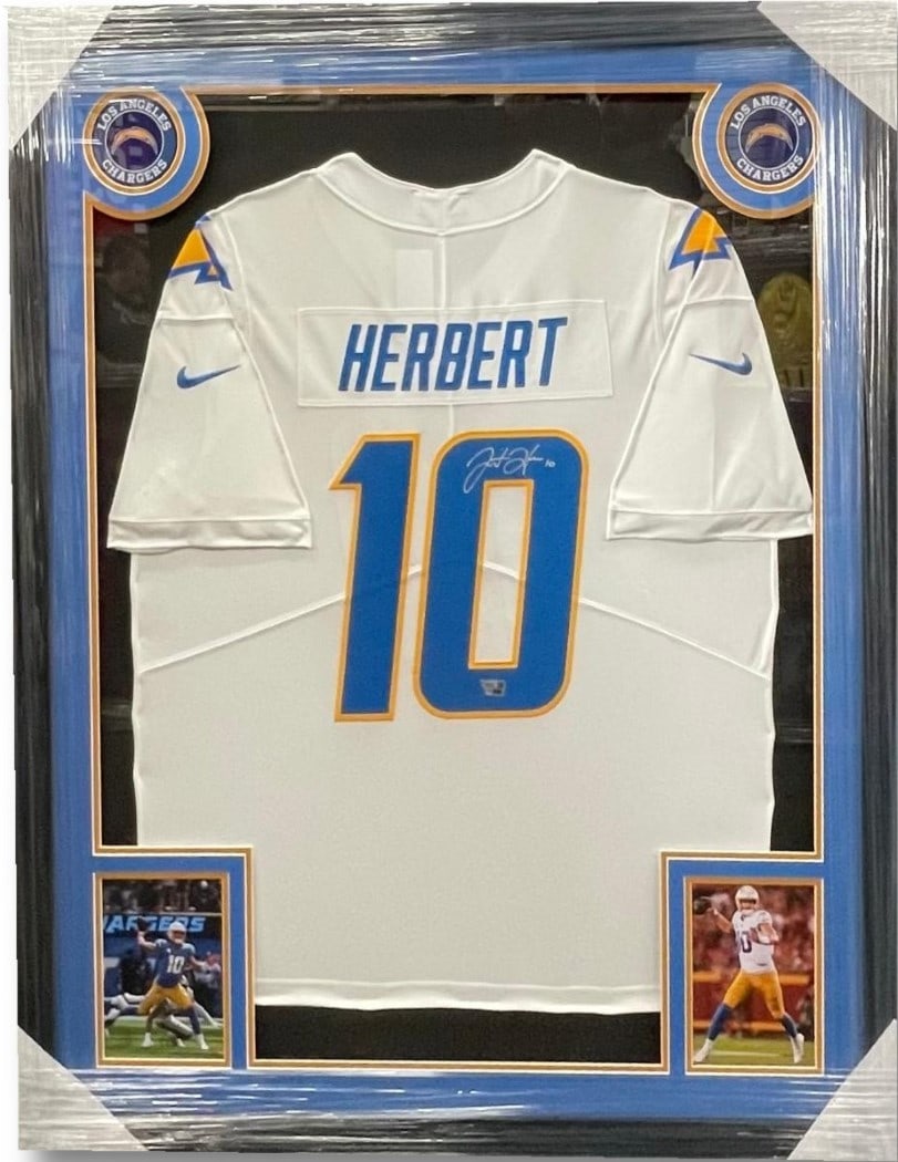 Justin Herbert Autographed Framed Jersey LA Chargers 32x40 Fanatics COA: Justin Herbert Autographed Framed Jersey LA Chargers 32x40 Fanatics COA Showcase your support for the Los Angeles Chargers with this authentic, hand-autographed white jersey by star quarterback Justin
