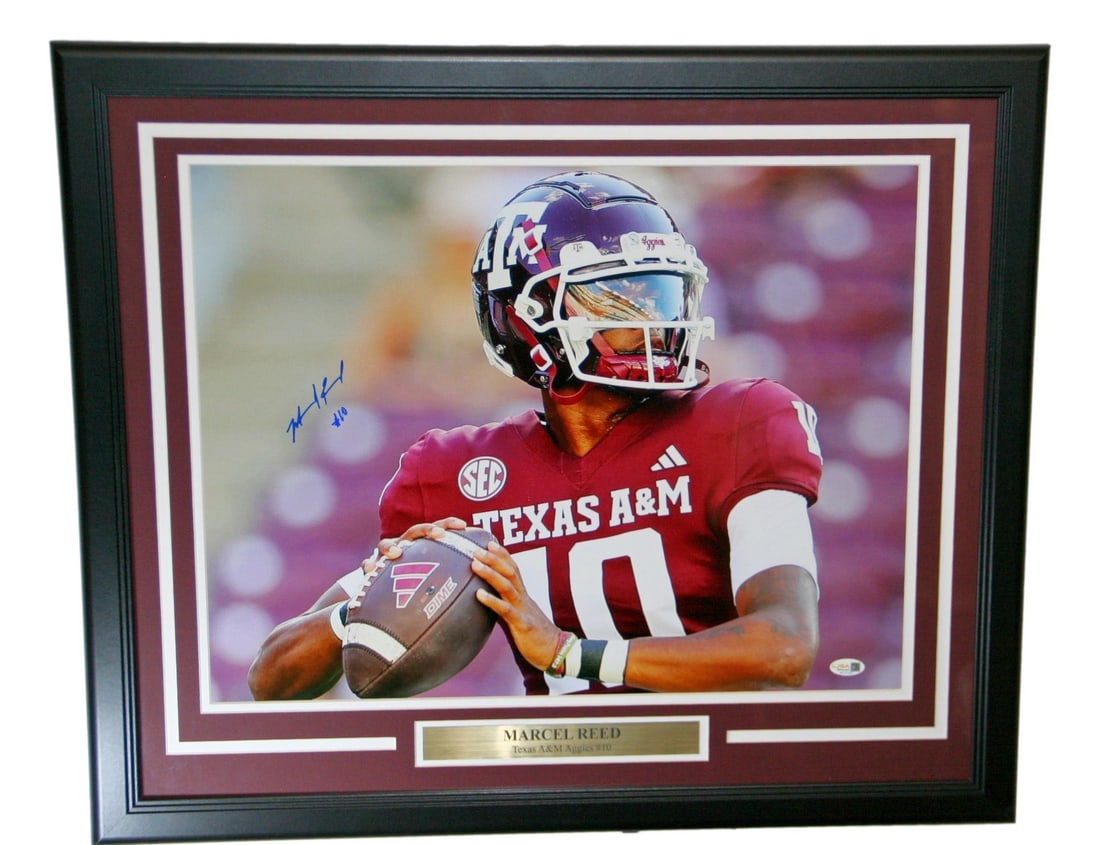 Marcel Reed Signed 16x20 Texas A&M Photo Framed JSA Authenticated: Marcel Reed Signed 16x20 Texas A&M Photo Framed JSA Authenticated This framed 16x20 photograph features Marcel Reed, a notable player from the Texas A&M Aggies football team. The photo is authenticate