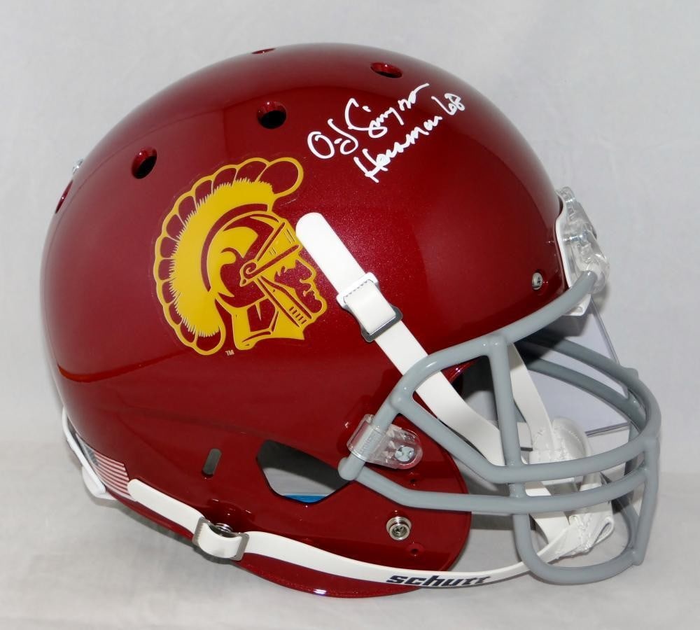 O J Simpson Signed USC Trojans Full Size Helmet JSA Auth: O J Simpson Signed USC Trojans Full Size Helmet JSA Auth This is an original USC Trojans full-size Schutt helmet signed by O.J. Simpson, a legendary football player and Heisman Trophy winner. The auto