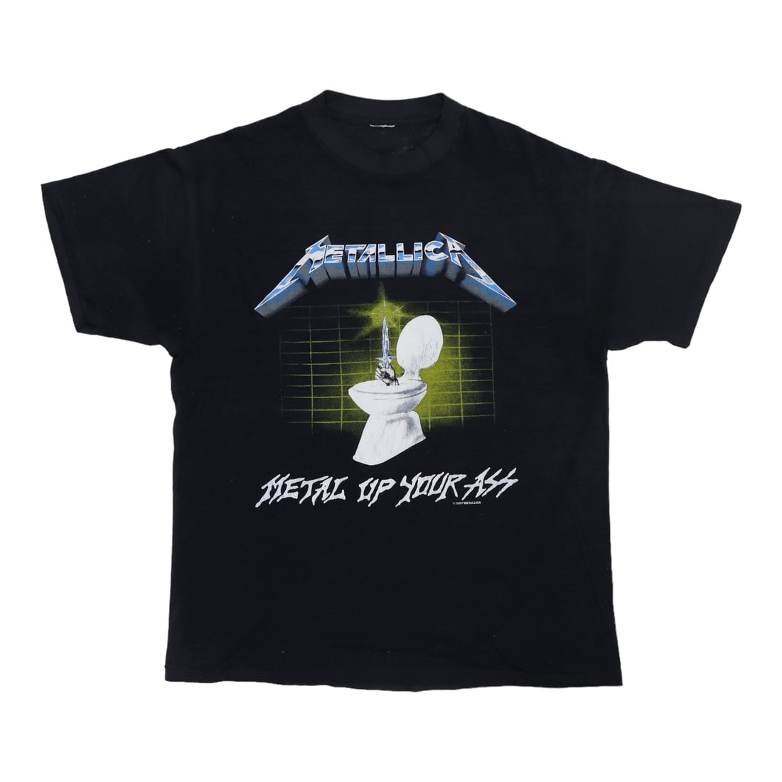 Vintage 1987 Metallica Metal Up Your Ass Black Poly Cotton Tee: Vintage 1987 Metallica Metal Up Your Ass Black Poly Cotton Tee This is an original vintage 1987 Metallica "Metal Up Your Ass" shirt featuring graphics on both the front and back. It is a true vintage